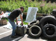 Pile of old tires and a television set all hauled out of the river