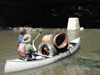 David and Bruce with trash-filled canoe