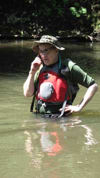 David on the phone in the middle of the river