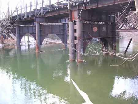 Railroad bridge footings in the river above the dam